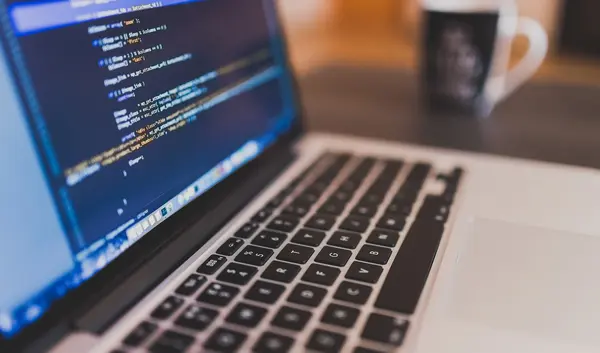 Computer with a code on the screen