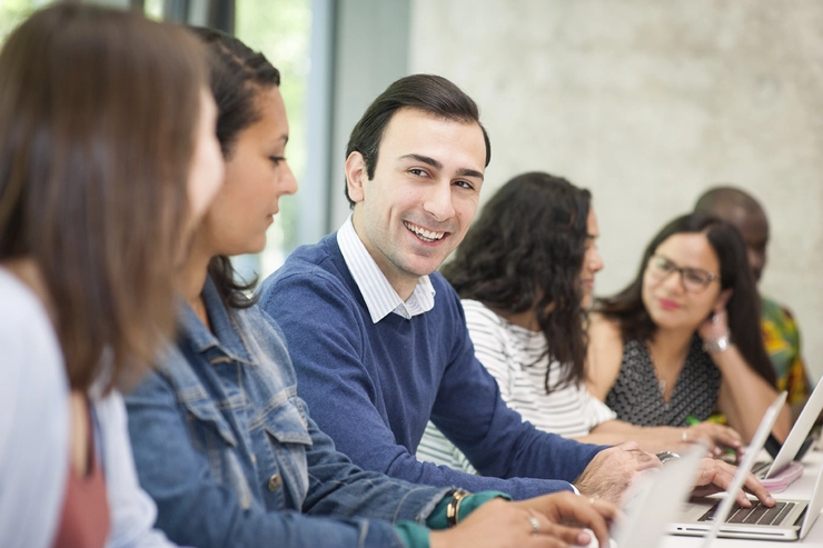 Students conversing in a classroom