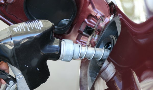 A car's gas tank being filled
