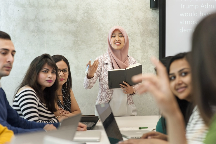 Student presenting in front of class